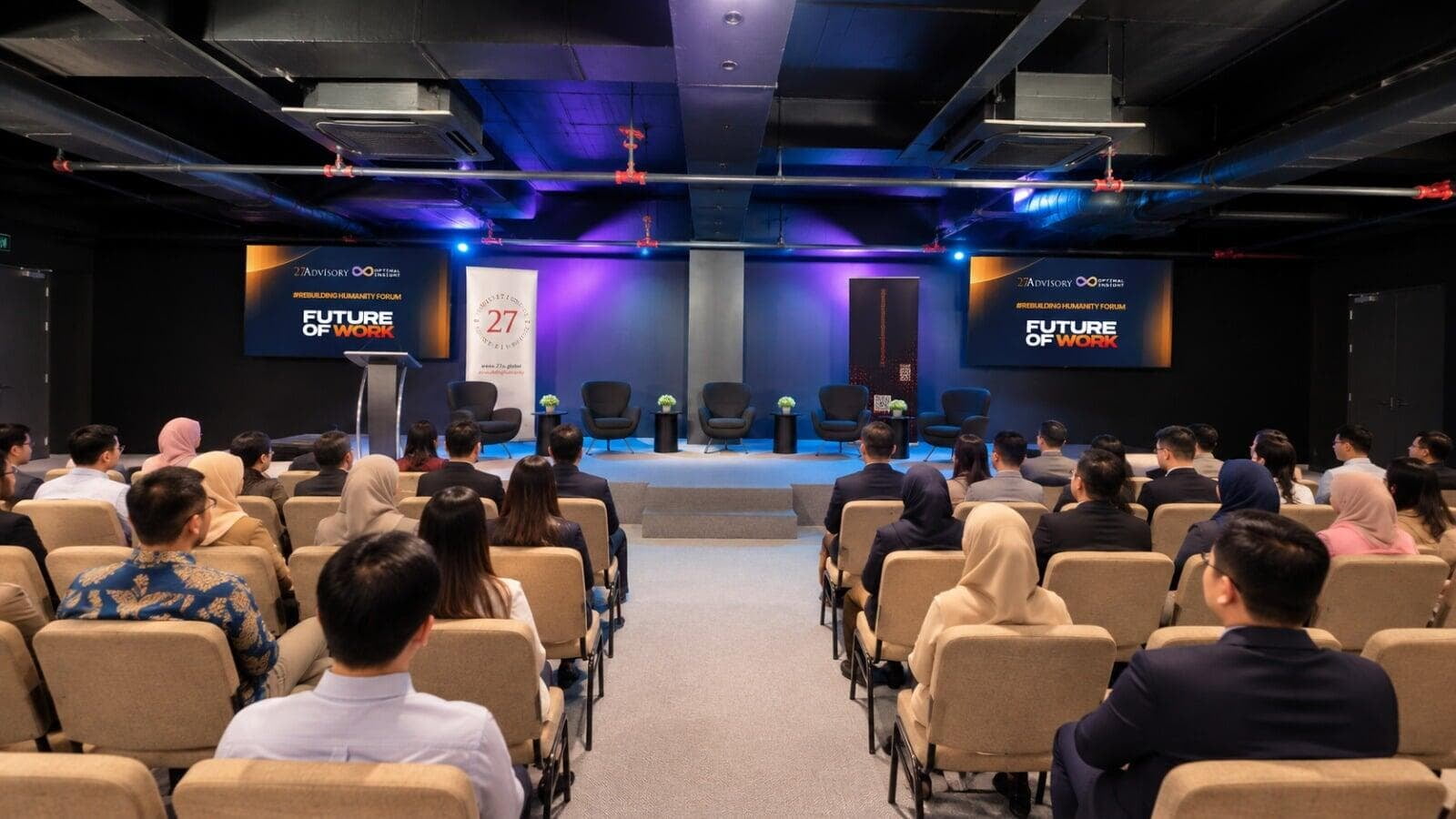 The event hall at Plaza Damansara, set up with theatre-style seating facing the stage and Future of Work screens